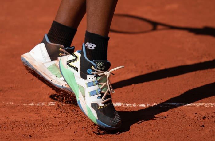 View of Coco Gauff's black and green New Balance shoes at the French Open.